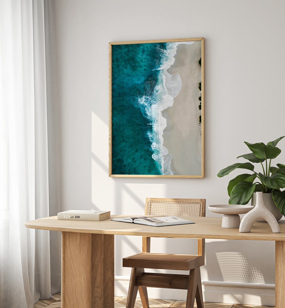 Bridal Veil Waves Beach Prints Coastal Wall Art in Oak Wood Plain Frame placed on a wall behind a study table