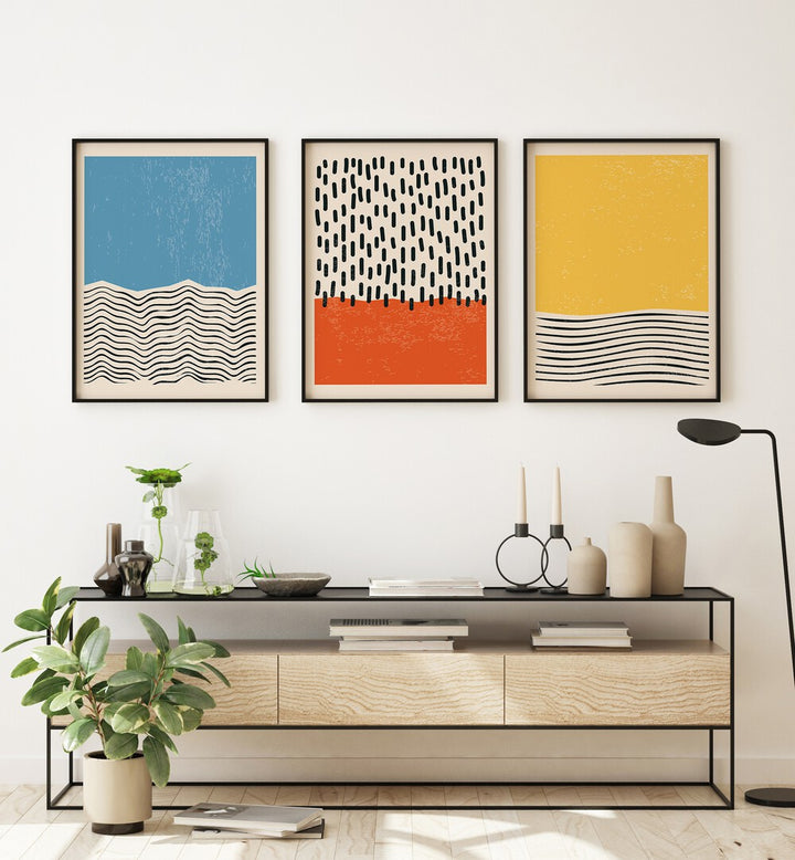 Bright Minimal Set I Set Of 3 Paintings in Black Plain Frame placed on a white wall behind a table