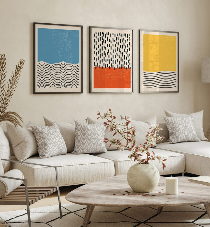 Bright Minimal Set I Set Of 3 Paintings in Black Plain Frame placed on a living room wall behind a sofa