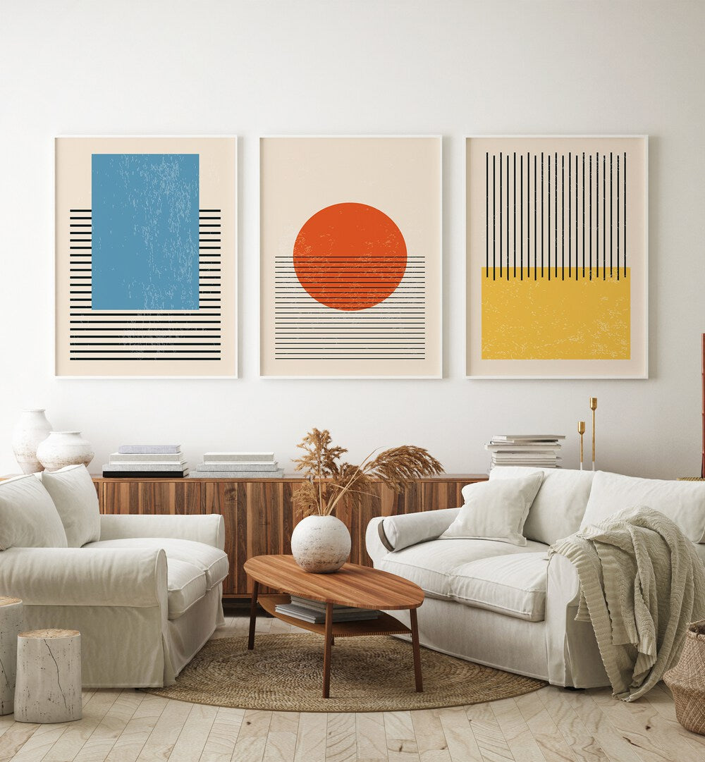 Bright Minimal Set ii Set Of 3 Paintings in White Plain Frame placed on a white wall behind a console table and sofa