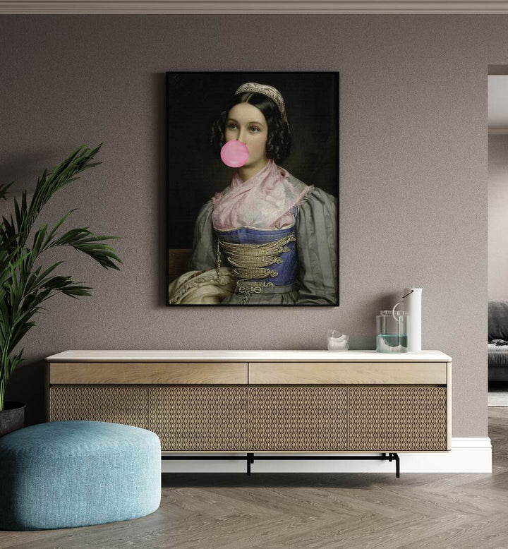 Bubble Gum Portrait by the Art Concept Altered Art Prints in Black Plain Frame placed on a wall behind a console table