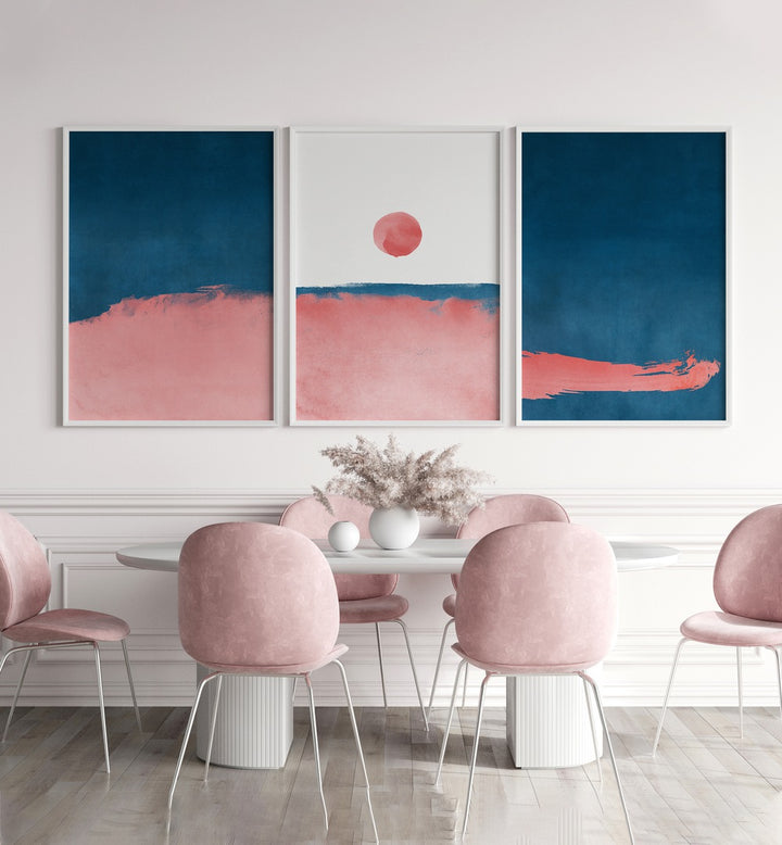 Bubblegum Mist Set Set Of 3 Paintings in White Plain Frame placed on a wall behind a table and chairs