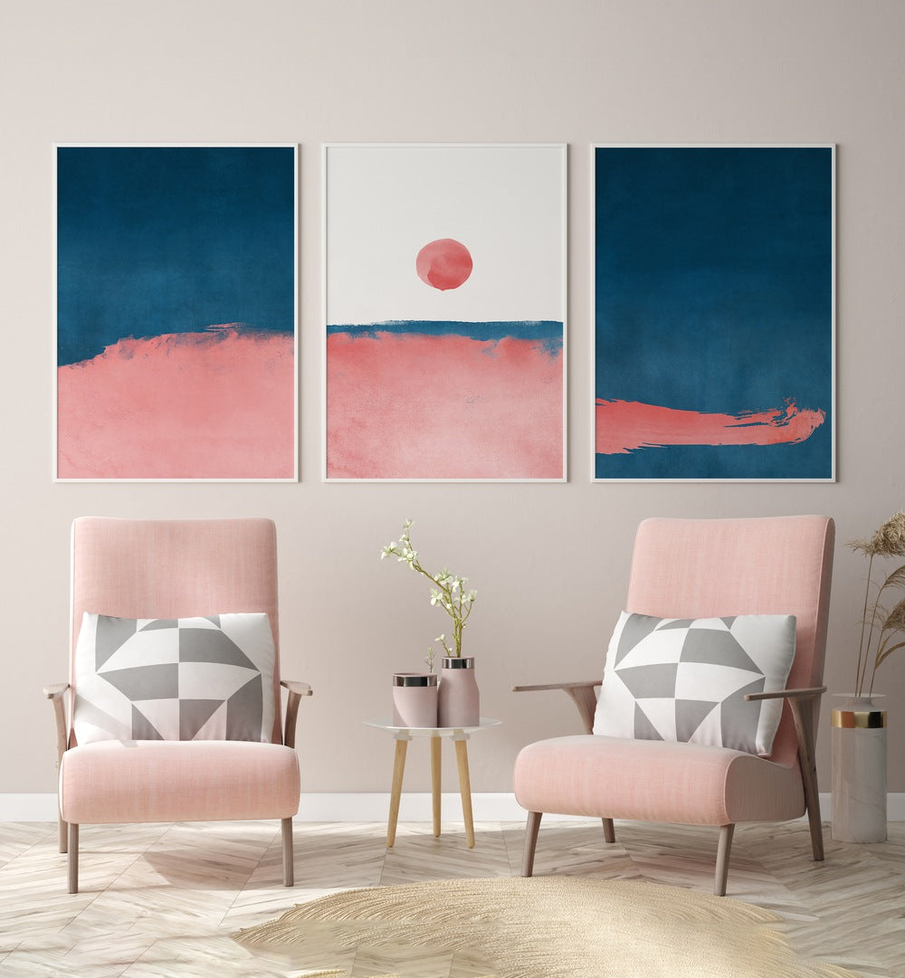 Bubblegum Mist Set Set Of 3 Paintings in White Plain Frame placed on the wall behind pink chairs and a table