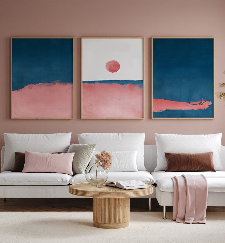 Bubblegum Mist Set Set Of 3 Paintings in Oak Wood Plain Frame placed on a living room wall behind a sofa