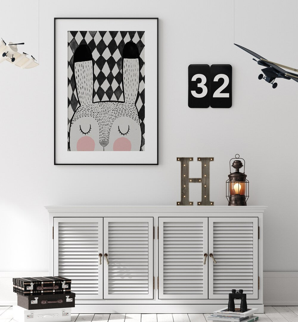 Bunny By Treechild Kids Room Wallart in Black Frame With Mount placed on a White Colored Wall above a Console Table in the Kids Room