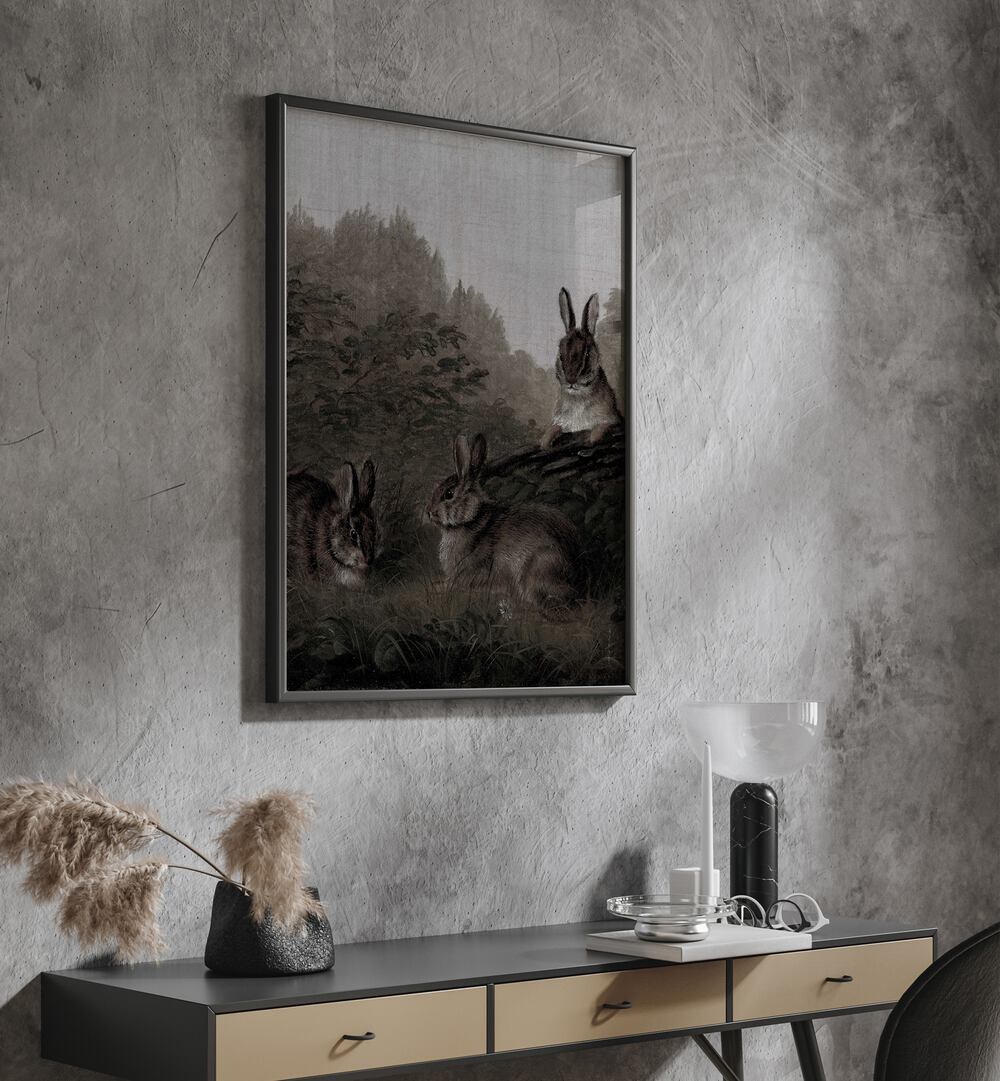 Bunny Dreams Whimsical Whiskers And Fluffy Tails Gothic Art Prints in Black Plain Frame hanging on wall above console table.