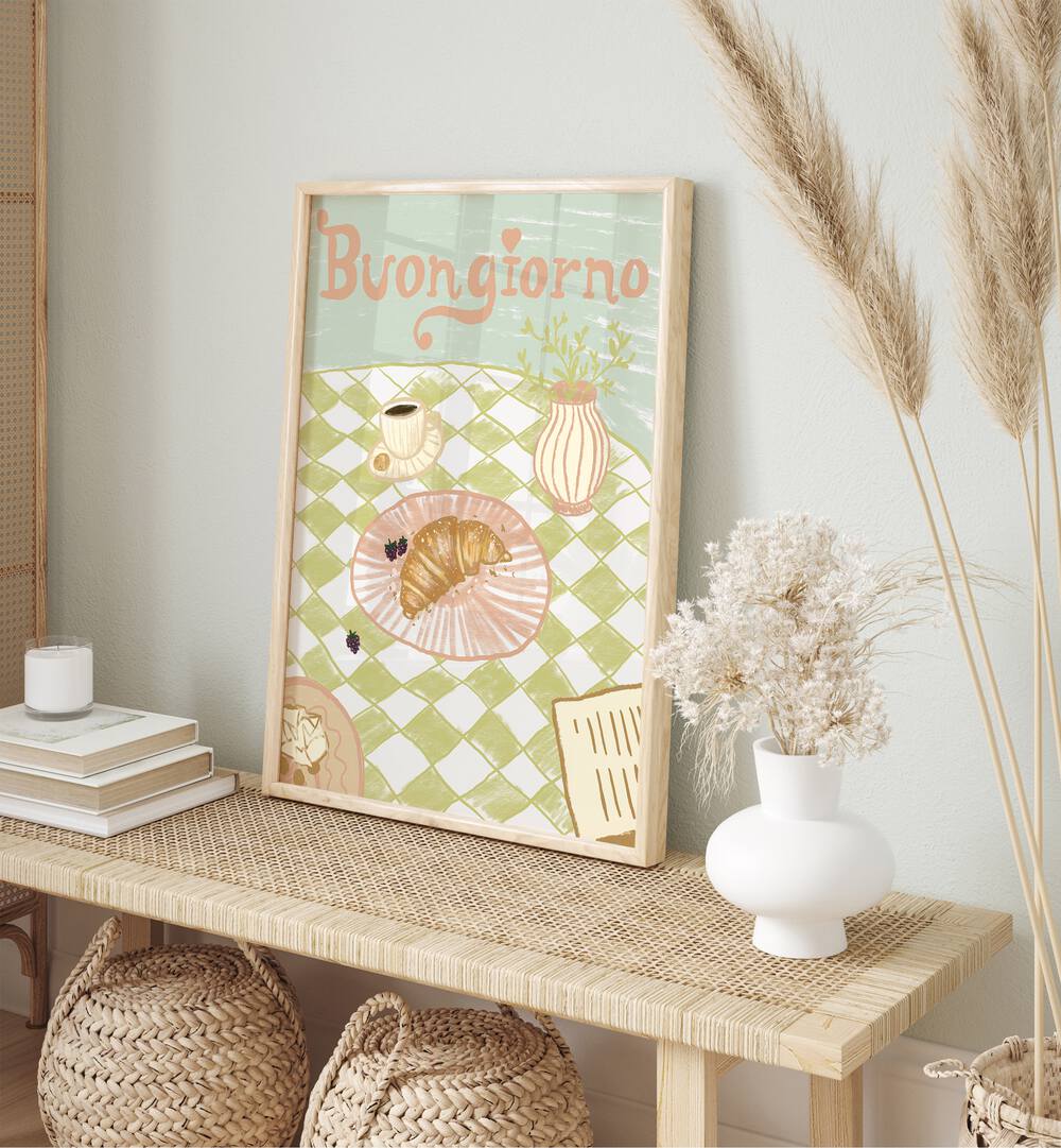 Buongirno by Studio Dolci Cafe Art Prints in Oak Wood Plain Frame placed on a table beside books