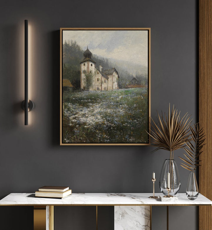 Church On The Hill Vintage Art Painting Artwork in oakwood floater frame above a white table beside a light