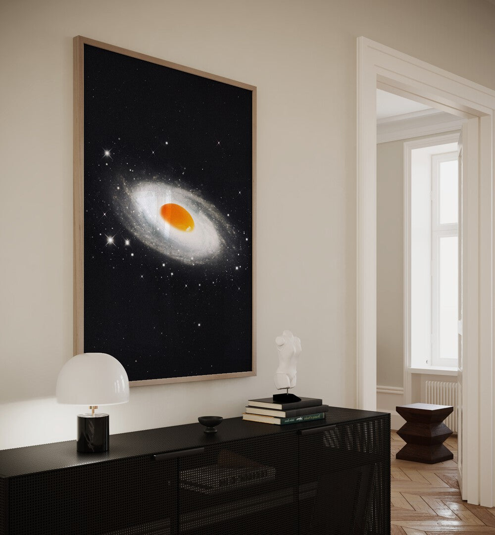 Cosmic Egg Surreal Art Painting Artwork in plain oakwood frame above a console table beside a lamp