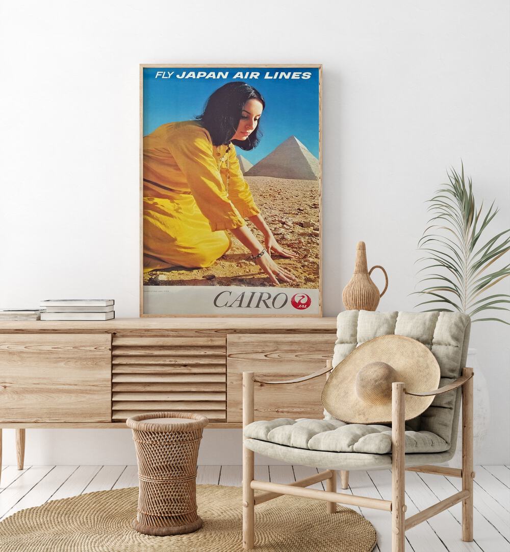 Cairo Retro Vintage Travel Vintage Travel Posters in Oak Wood Plain Frame on a console table beside a plant