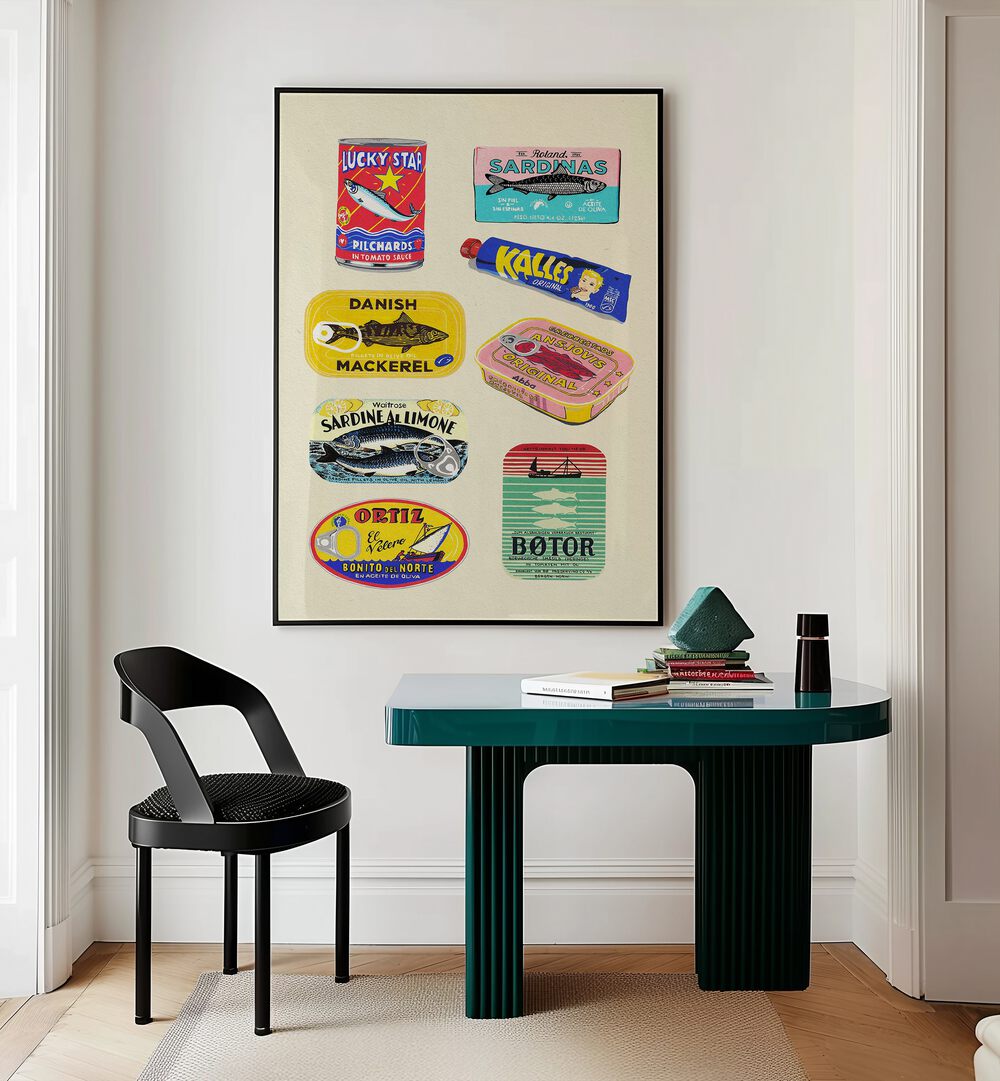 Canned Fish by Studio Mandariini Kitchen Posters Kitchen Art Prints in Black Plain Frame placed on a wall behind a study table