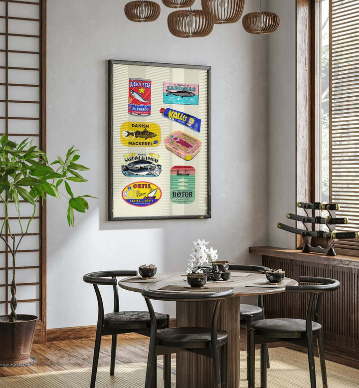 Canned Fish by Studio Mandariini Kitchen Posters Kitchen Art Prints in Black Plain Frame placed on a wall in a dining room area behind a dining table and beside a window