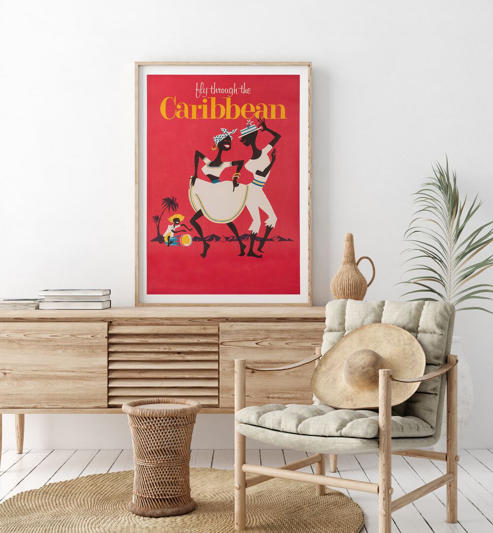 Caribbean  Retro Travel Posters in Oak Wood Plain Frame placed on a console table behind a chair