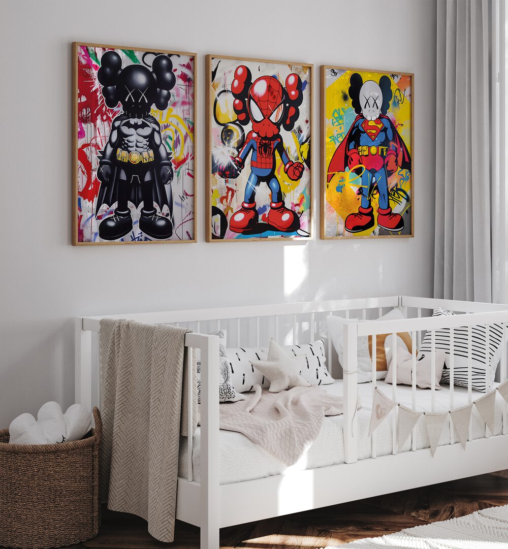 Cartoon Superhero Set Set Of 3 Paintings in Oak Wood Plain Frame placed on a kids bedroom wall behind a infant's bed