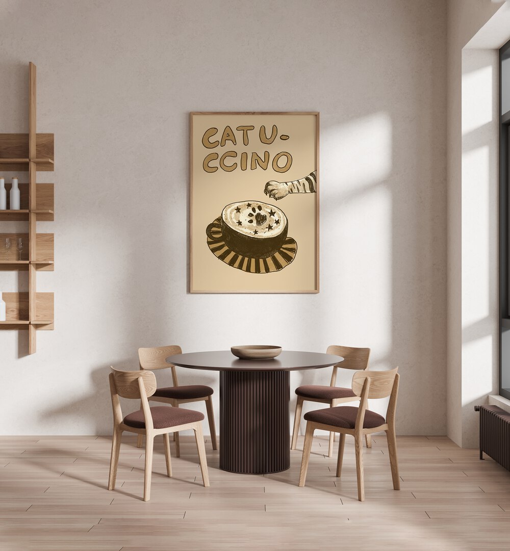 Catuccino by Studio Dolci Cafe Art Prints in Oak Wood Plain Frame placed on a wall behind a dining table 