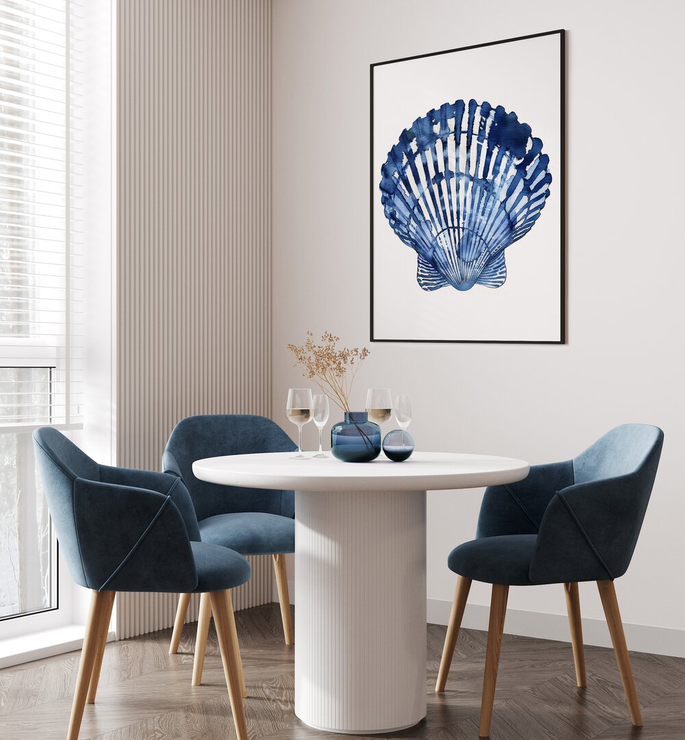 Cerulean Conch I Beach Prints Coastal Wall Art in Black Plain Frame placed on a white wall behind a dining table 