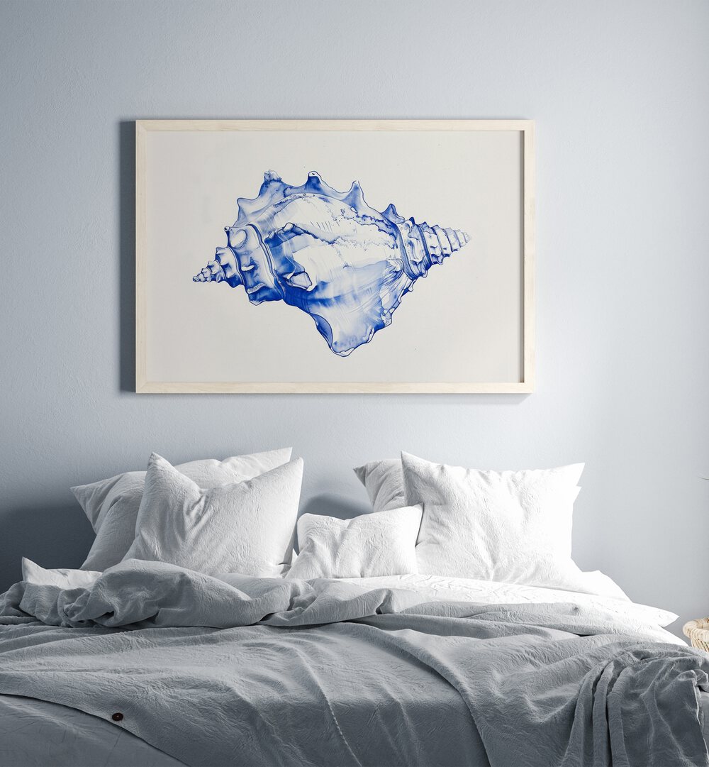 Cerulean Conch Iv Beach Prints Coastal Wall Art in White Plain Frame placed on a wall behind a bed for bedroom