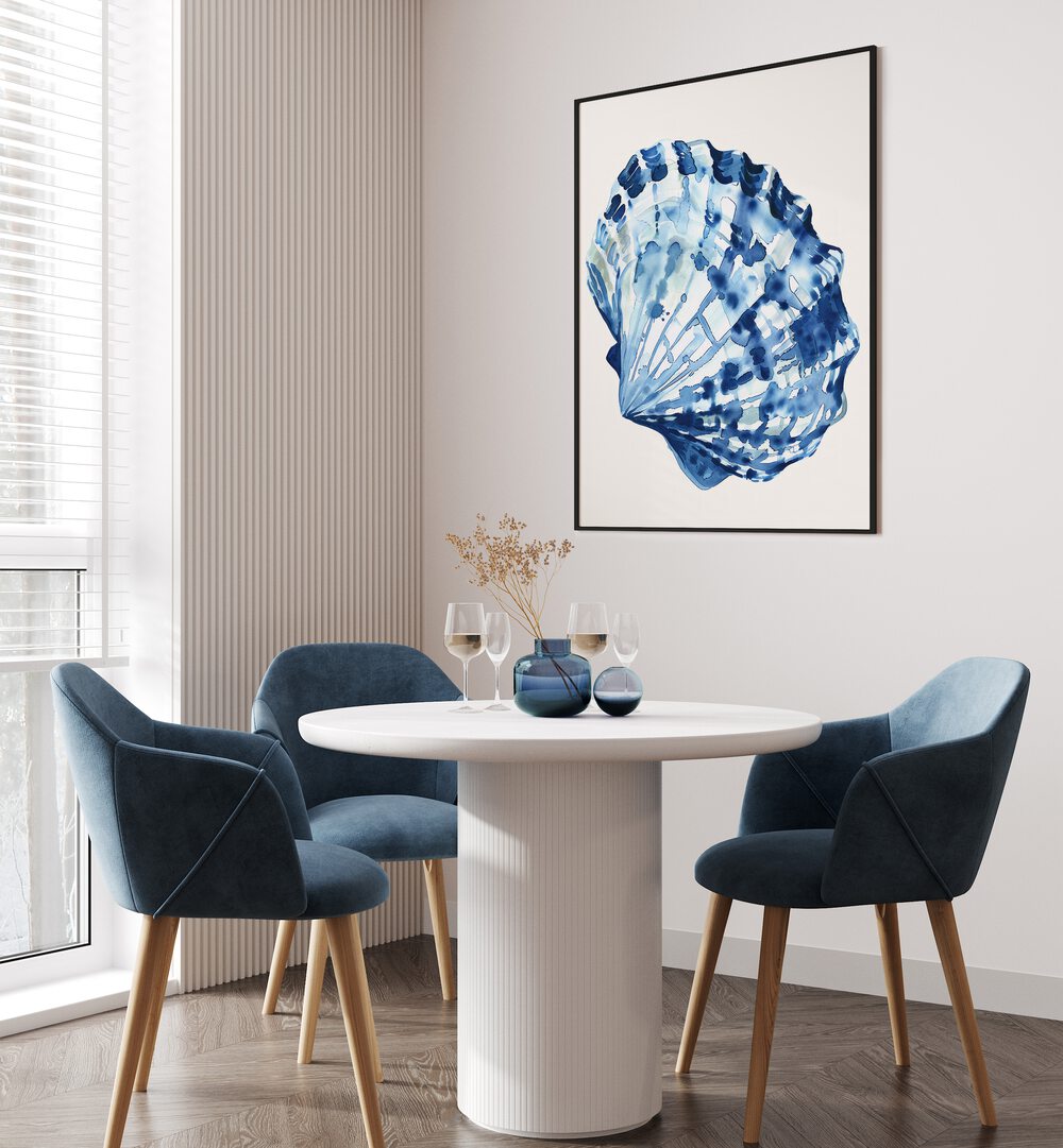 Cerulean Conch ii Beach Prints Coastal Wall Art in Black Plain Frame placed on a white wall beside dining table