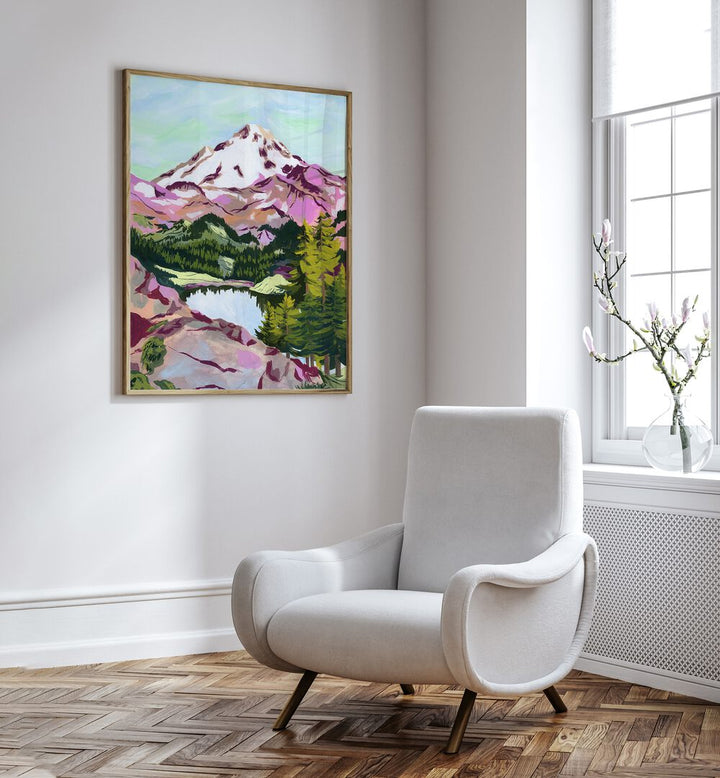 Chain Lakes By Sarah Gesek Landscape Art Prints in Oak Wood Plain Frame placed on a white wall beside a chair and a window