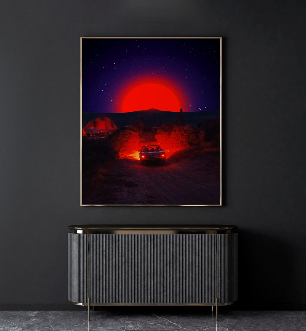 Chasing The Red Sun By Ritvik Takkar Surreal Art Prints in Gold Plain Frame placed on a Dark Grey Colored Wall above a Console Table in the Drawing Room