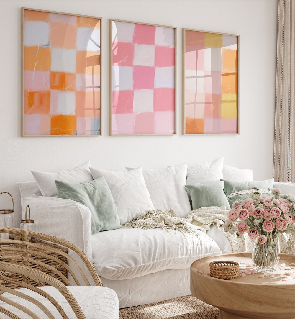 Checkered Colors Set Of 3 Paintings in Oak Wood Plain Frame placed on a living room wall behind a sofa