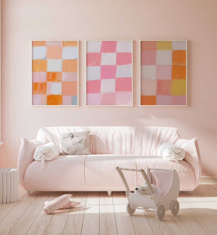 Checkered Colors Set Of 3 Paintings in White Plain Frame placed on a living room wall behind a sofa