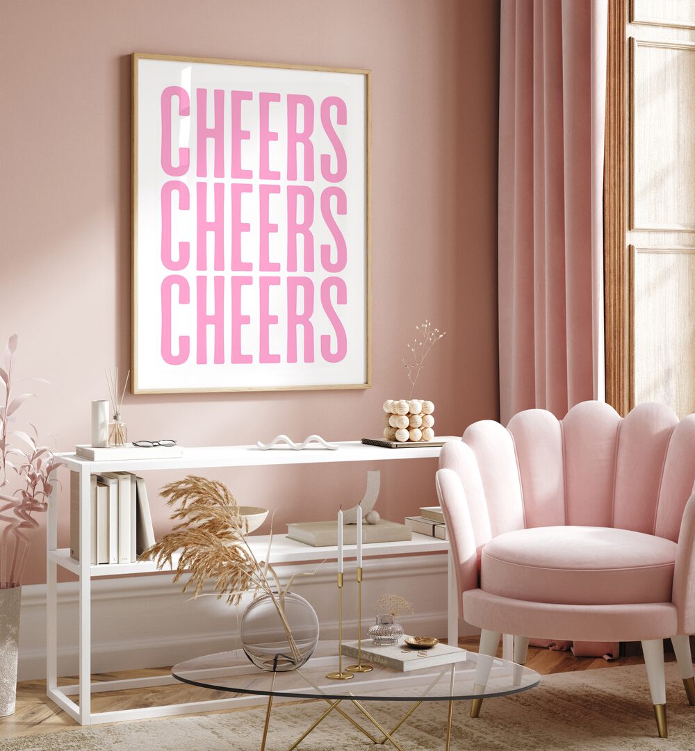 Cheers by Athene Fritsch Cafe Art Prints Cafe Posters in Oak Wood Plain Frame placed on a pink wall beside a window and behind a table