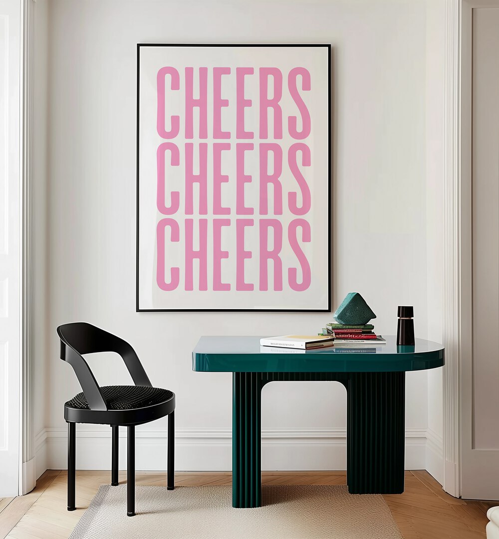 Cheers by Athene Fritsch Cafe Art Prints Cafe Posters in Black Plain Frame placed on a wall behind a study table