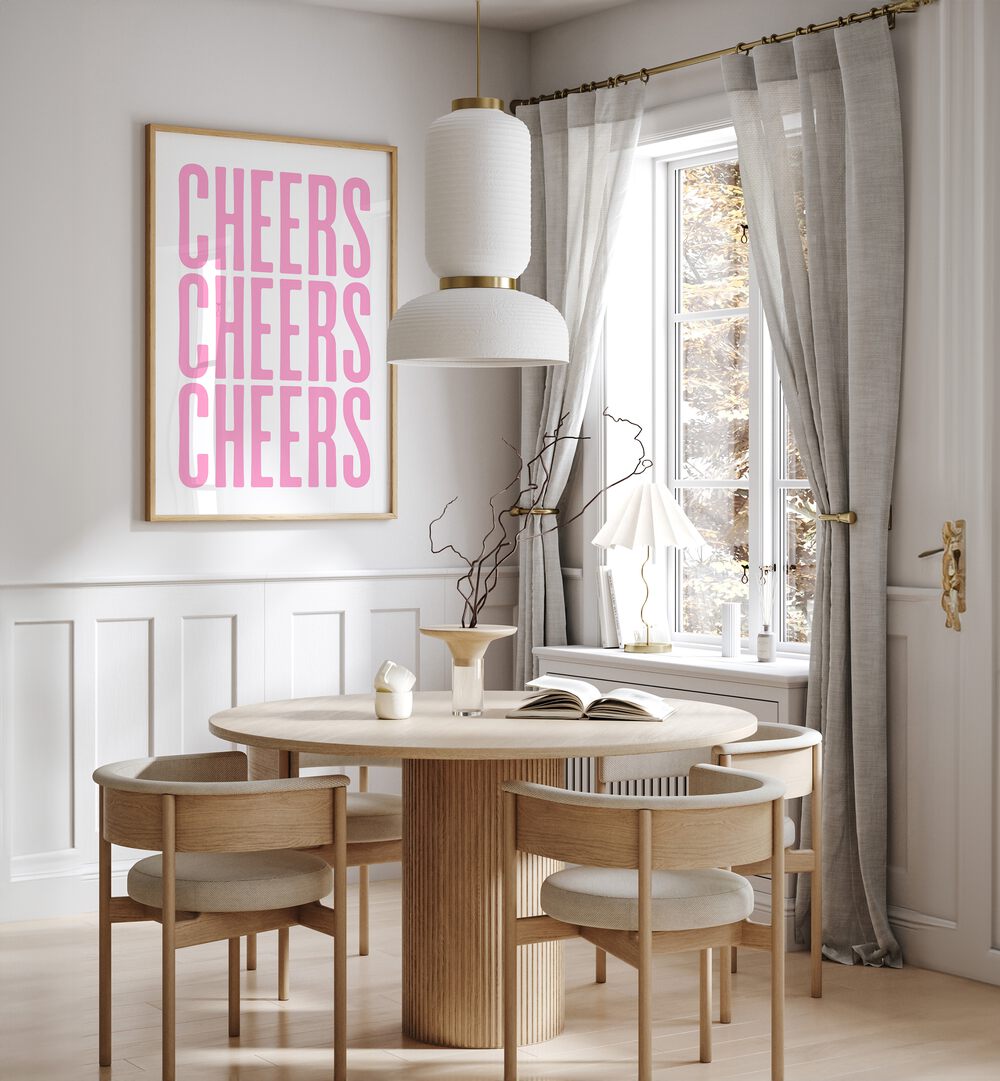 Cheers by Athene Fritsch Cafe Art Prints Cafe Posters in Oak Wood Plain Frame placed on a wall in a dining room area beside a window and behind a dining table