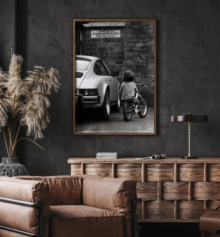 Childhood Dreams Street Photography Fine Art Photography in Oak Wood Plain Frame placed on a Dark Grey Colored Wall above a Console Table near a Brown  Sofa Chair in the Living Room