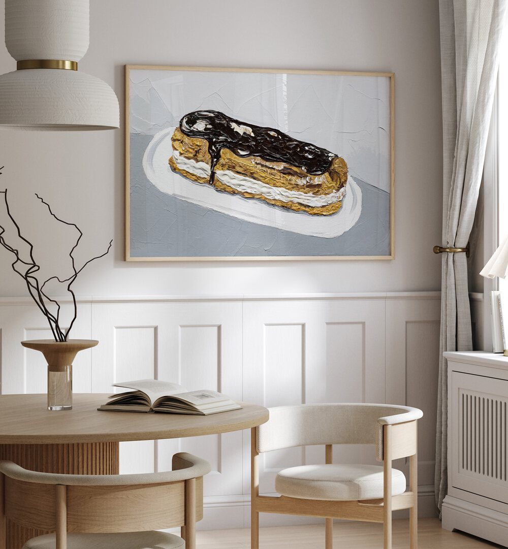 Chocolate Eclair by Alice Straker Cafe Art Prints Cafe Posters in Oak Wood Plain Frame placed on a wall in a dining room area beside a window and behind a dining table