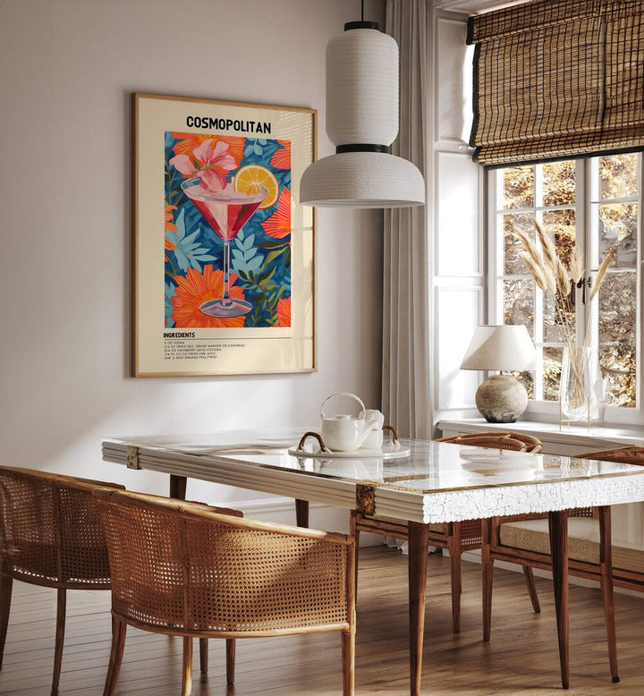 City Lights in a Glass Cosmopolitan Cafe Art Prints Cafe Posters in Oak Wood Plain Frame placed on a wall in a dining room area beside a window and behind a dining table