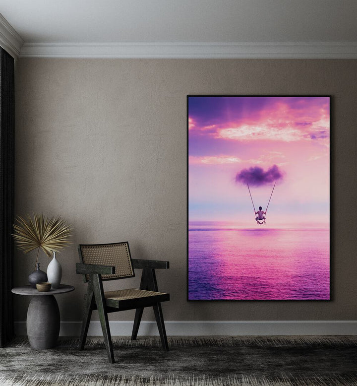 Cloud Swing By Ritvik Takkar Surreal Art Prints in Black Plain Frame placed on a Beige Colored Wall in the Drawing Room