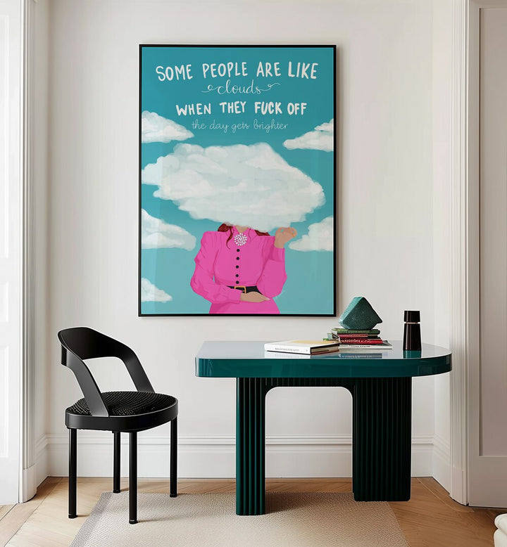 Clouds Quotes And Typography Posters in Black Plain Frame placed on a Cream Colored Wall near a Workspace in the Drawing Room