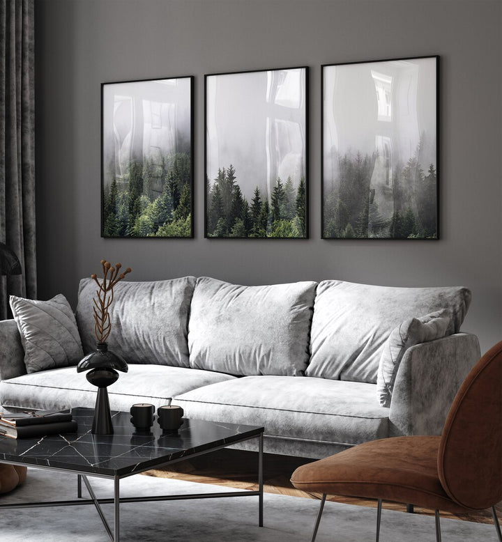 Cloudy Mountains Set Of 3 Paintings in Black Plain Frame placed on a living room wall behind a sofa