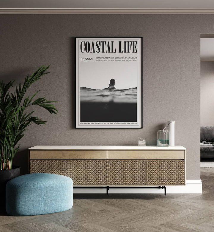 Coastal Life Iv Beach Prints Coastal Wall Art in Black Plain Frame placed on a wall behind a console table and beside a plant