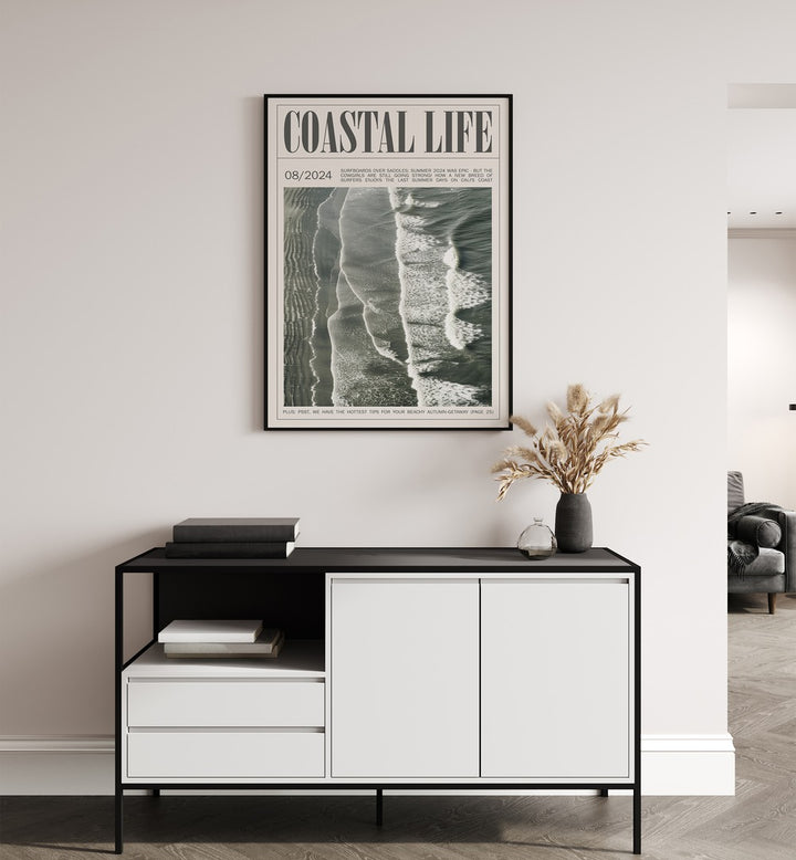 Coastal Life iii Beach Prints Coastal Wall Art in Black Plain Frame placed on a wall behind a black & white table