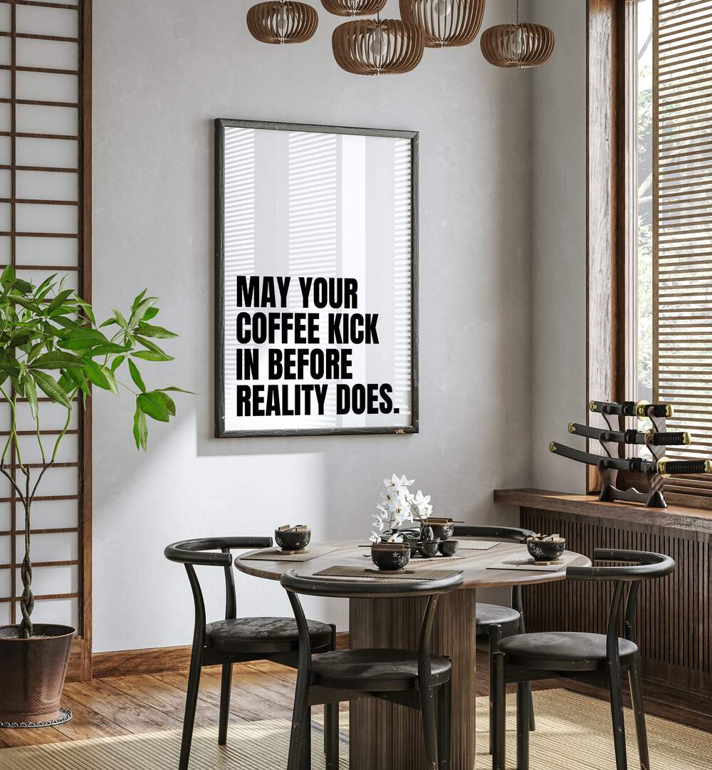 Coffee Kick by Athene Fritsch Quotes and Typography Posters in Black Plain Frame placed on a wall in a dining room area beside a window and behind a dining table