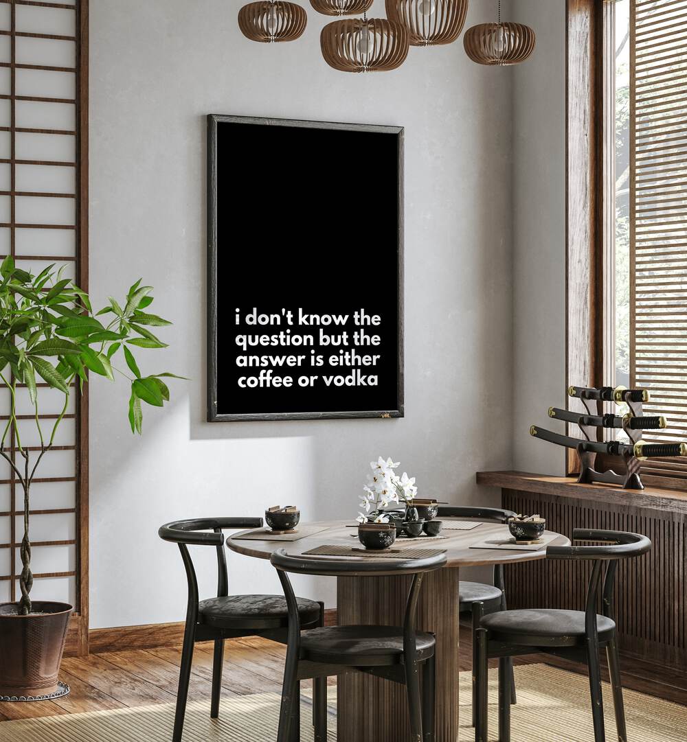 Coffee or Vodka by Athene Fritsch Quotes and Typography Posters in Black Plain Frame placed on a wall in a dining room area beside a window and behind a dining table