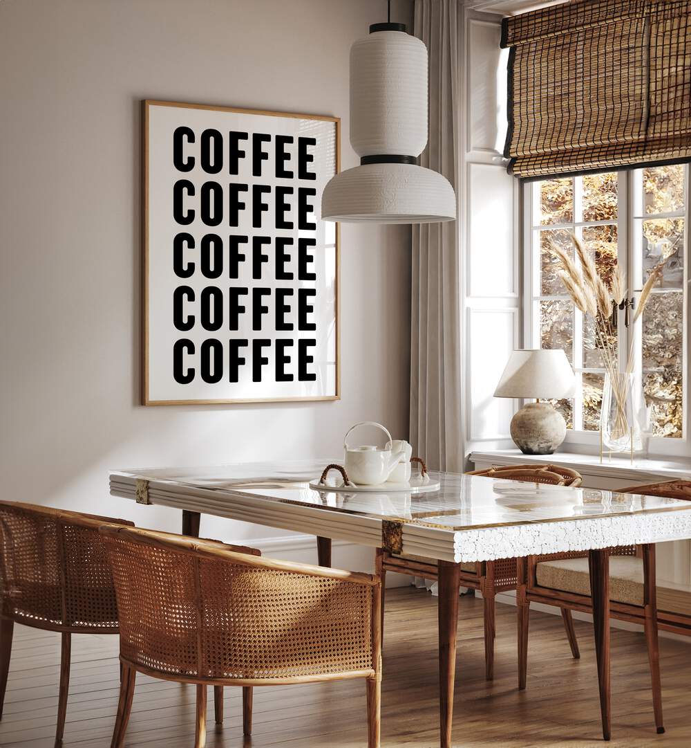 Coffeee by Athene Fritsch Quotes and Typography Posters in Oak Wood Plain Frame placed on a wall in a dining room area beside a window and behind a dining table