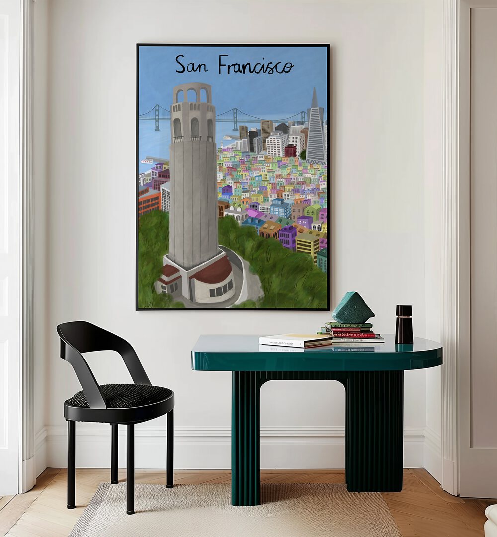 Coit Tower by Carla Daly Travel Posters in Black Plain Frame placed on the wall behind a study table