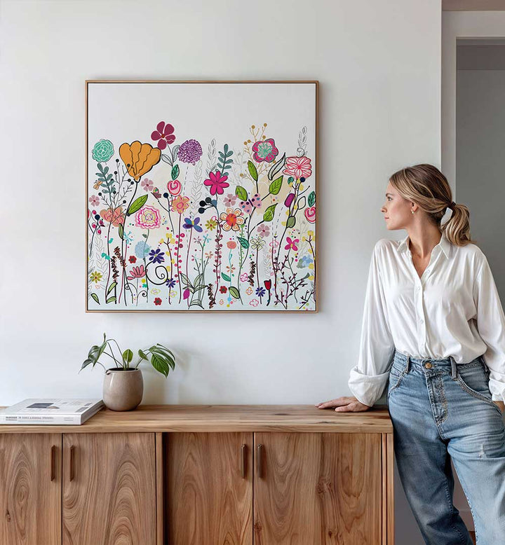 COLORFUL WILDFLOWERS , KIDS ROOM PAINTINGS framed whimsical wildflower canvas in pastels above a wooden sideboard