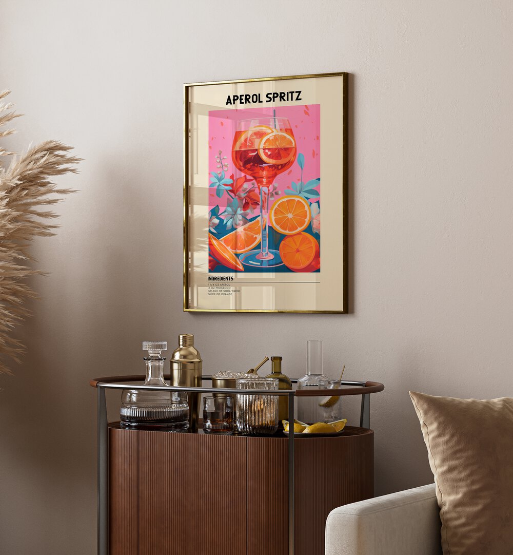 Colourful Aperol Spritz Cafe Art Prints Cafe Posters in Gold Plain Frame placed on a wall behind a table