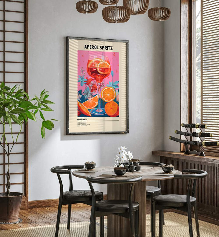 Colourful Aperol Spritz Cafe Art Prints Cafe Posters in Black Plain Frame placed on a wall in a dining room area beside a window and behind a dining table