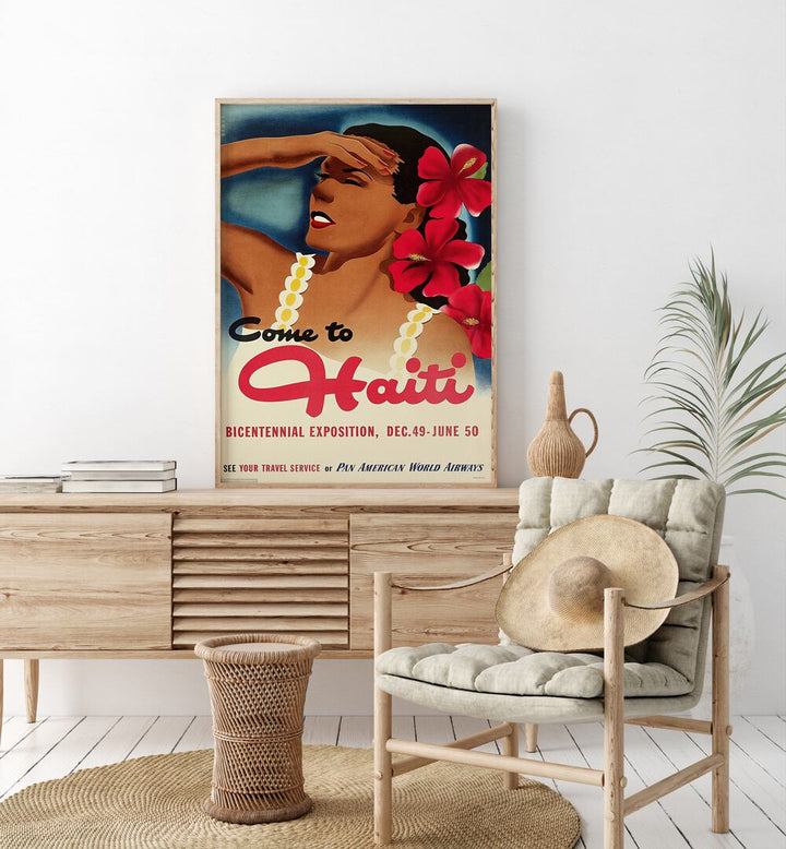 Come To Haiti-Dec 49-June 50 Retro Vintage Travel Travel Posters in Oak Wood Plain Frame on a console table beside a plant