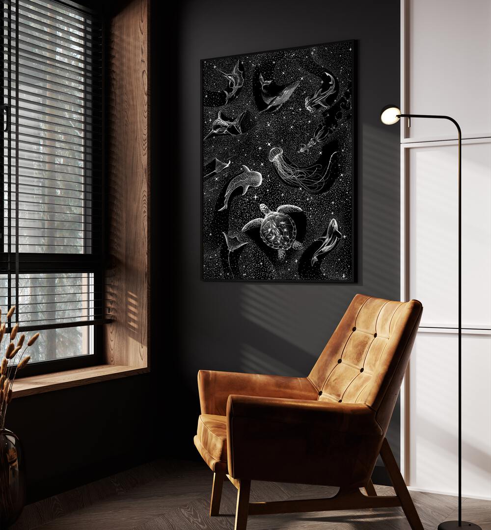 Cosmic Ocean Black Version II By Aliriza Cakir Surreal Paintings Surreal Art in Black Plain Frame placed on a Dark Grey Colored Wall near a Brown Sofa Chair in the Drawing Room