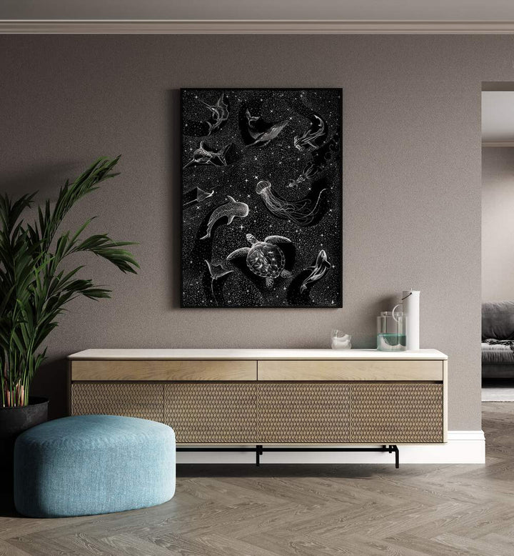 Cosmic Ocean Black Version II By Aliriza Cakir Surreal Paintings Surreal Art in Black Plain Frame placed on a Beige Colored Wall above a Console Table in the Drawing Room