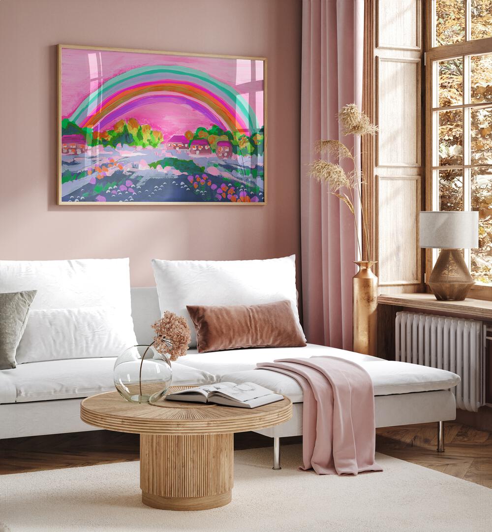 Countryside Rainbow On Pink By Ania Zwara Kids Room Paintings Kids Room Wallart in Oak Wood Plain Frame placed on a Pink Colored Wall near a White Sofa in the Living Room