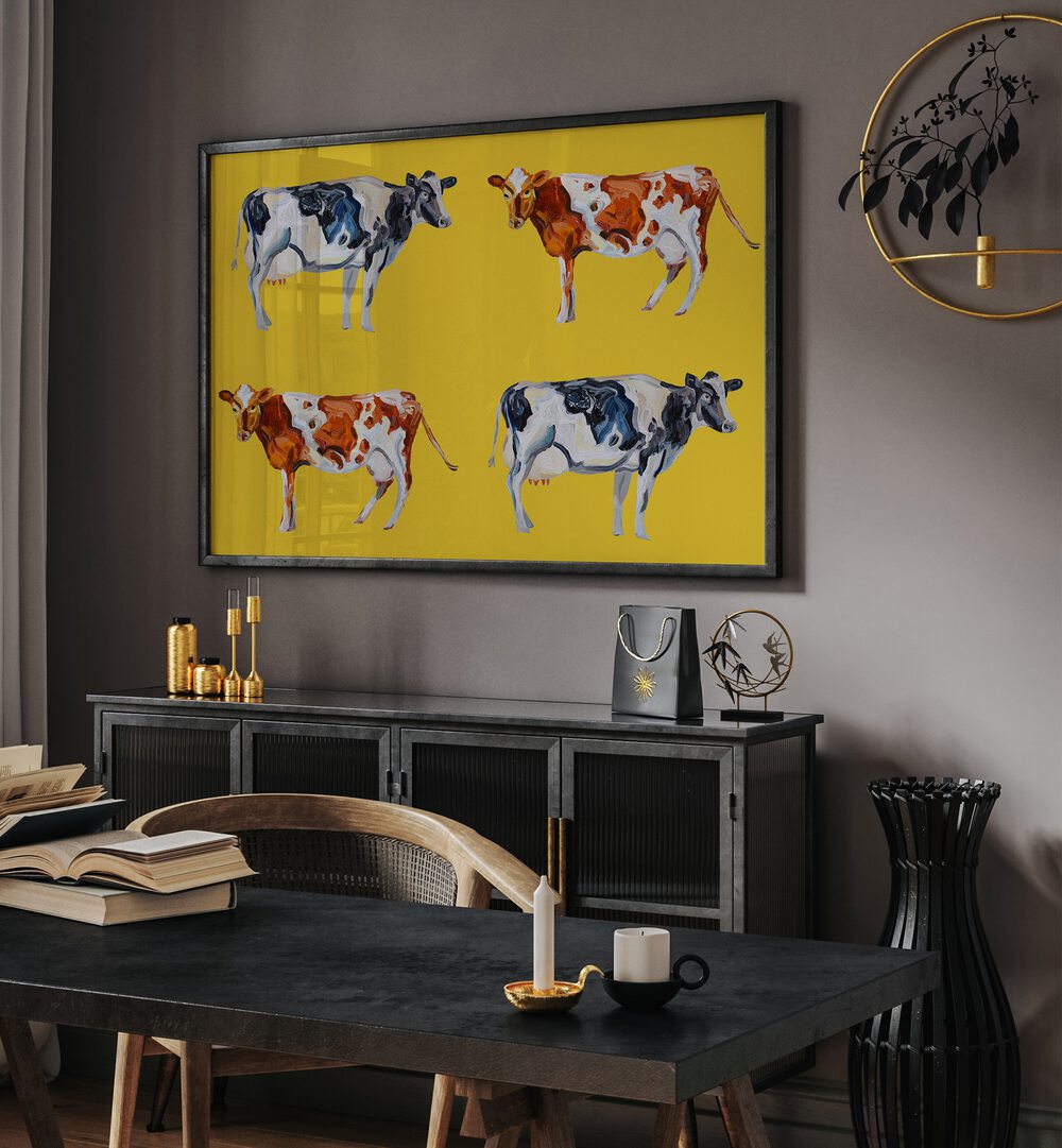 Cow Art on Yellow by Alice Straker Wildlife Paintings Wildlife Posters in Black Plain Frame placed on a wall behind a black console table