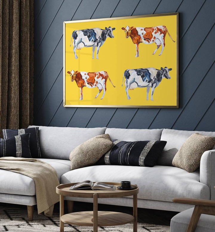 Cow Art on Yellow by Alice Straker Wildlife Paintings Wildlife Posters in Gold Plain Frame placed on a living room wall behind a sofa